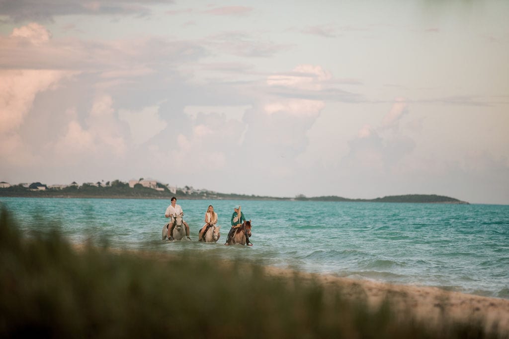 Riding out through the shallows at dusk