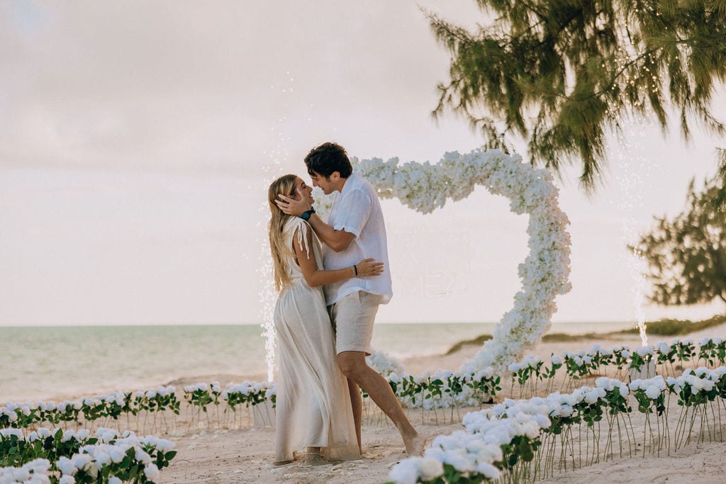 The first kiss after yes, in front of the arch