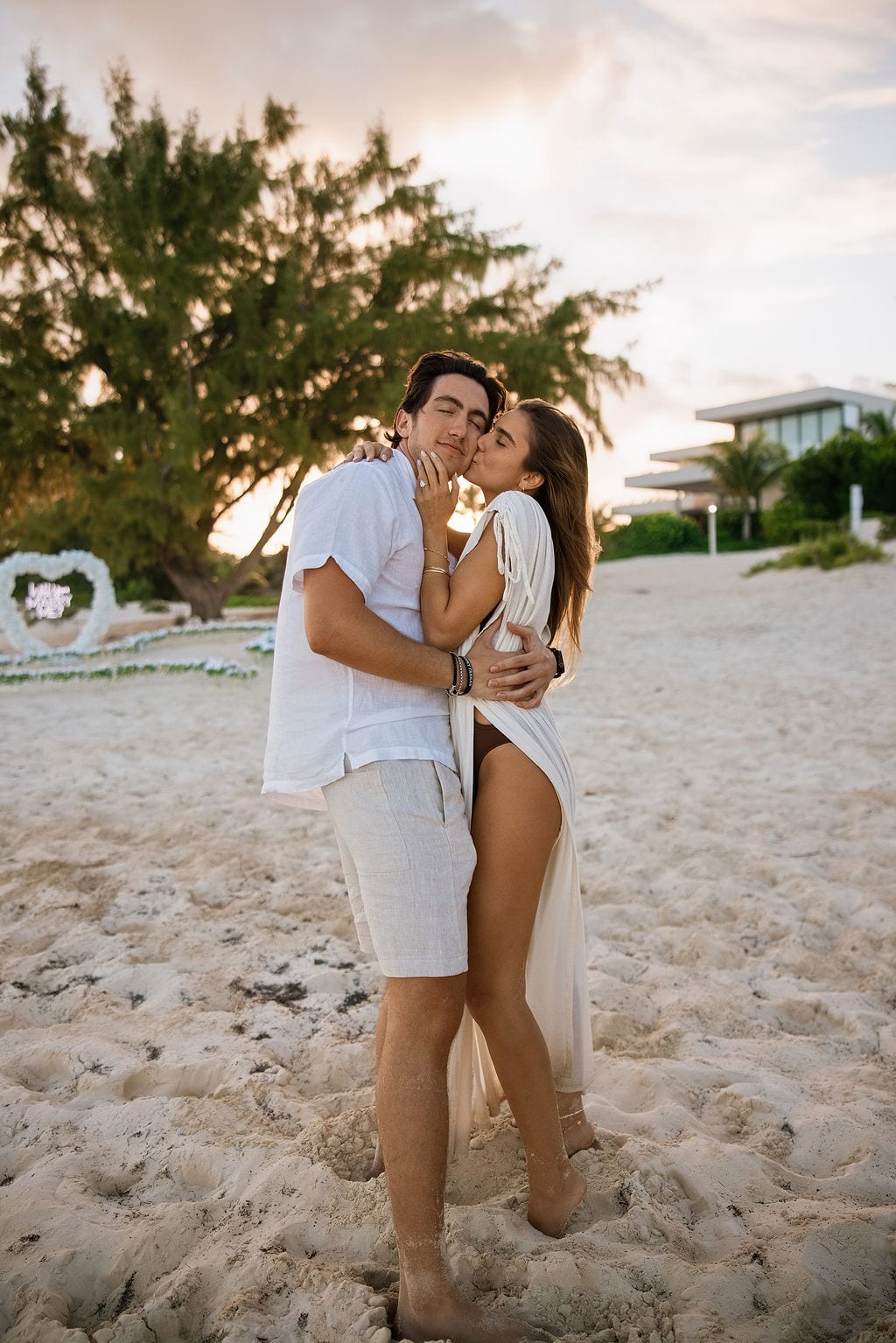 Holding each other as the sun goes down